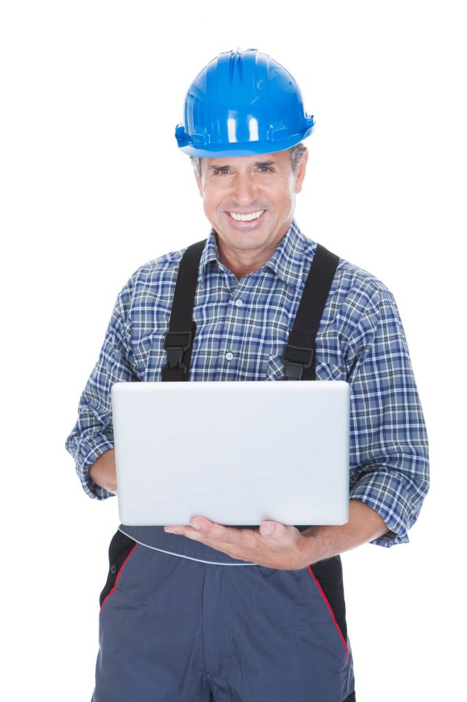 Worker Wearing Hard Hat And Using Laptop